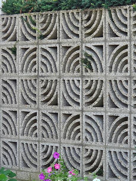istock Cement decorative landscaping bricks stacked on top of each other to create a surrounding wall in a backyard domestic garden. 2226727625