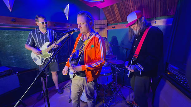 istock Middle aged men playing together in a band 2226728252