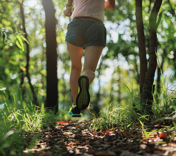 istock Woman trail runner running at tropical forest mountain peak 2226728488
