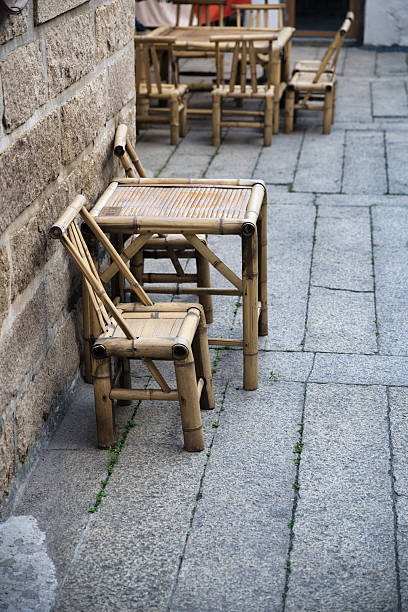 istock Bamboo Tables and Chairs Beside a Stone Wall 2226729974