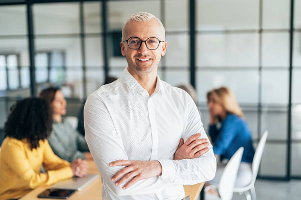 istock Confident Businessman Smiling in a Modern Office 2226730863