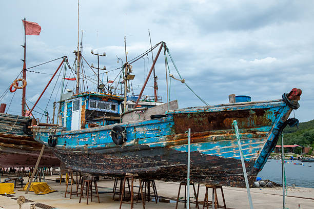 istock Old Fishing Boat with Rusty Surface on Docks 2226731430