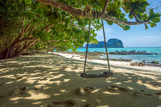 istock Wooden swing on a paradise beach on Bamboo Island in Phi Phi Islands 2226732011