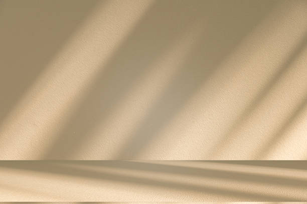 istock Studio style background wall decoration presentation uses white and beige tones. with shadows cast from a nearby window, concept creating a decorative 2226733003