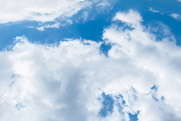 istock Blue sky with fluffy white clouds, perfect for backgrounds and nature concepts 2226734611