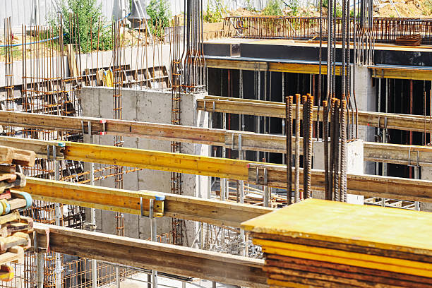 istock Construction site with concrete base. Industrial building under development. Reinforced steel bars and formwork. 2226736570