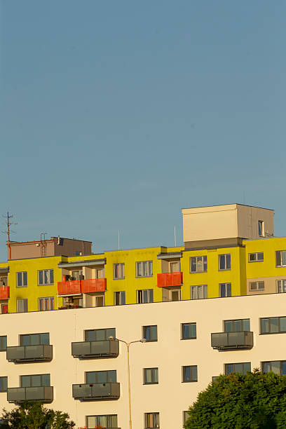 istock A yellow and white building with balconies against a blue sky 2226739239