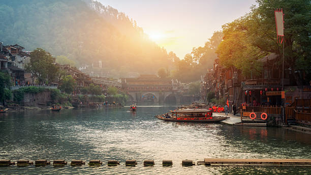 istock Scenic river view with traditional buildings and warm sunlight 2226740441