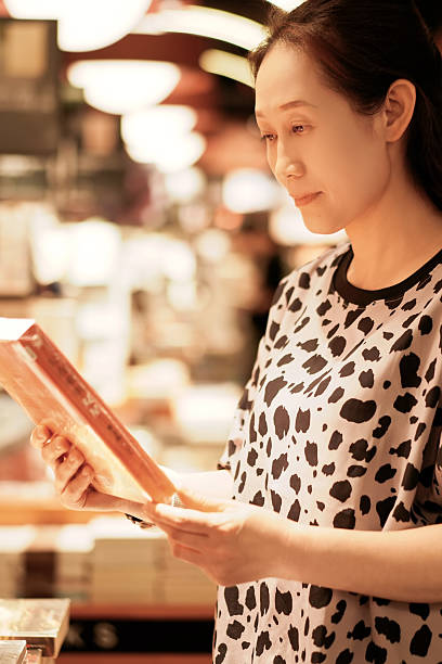 istock Woman reading a book in a cozy indoor setting 2226742863