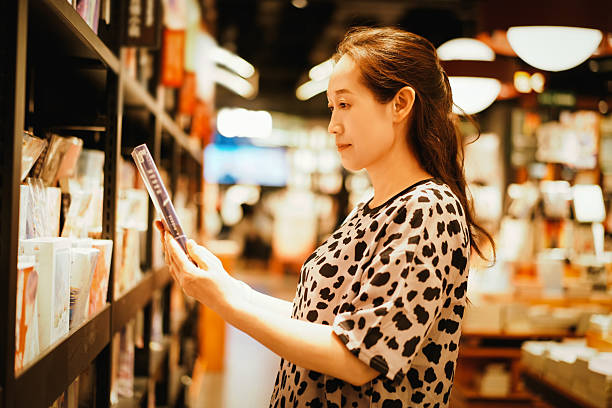 istock A woman reading a book in a cozy bookstore environment 2226742895