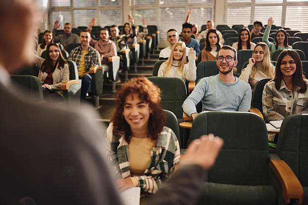 istock Happy college students attending a lecture in amphitheater. 2226743151