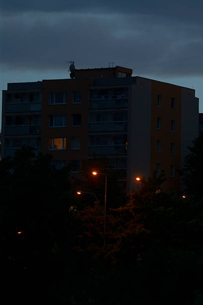 istock A building is illuminated at night with a street light nearby 2226743510