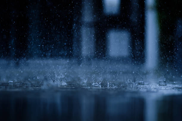 istock heavy raining make many small splash crown from water droplets drop down to the concrete floor in blue tone color scene 2226745196