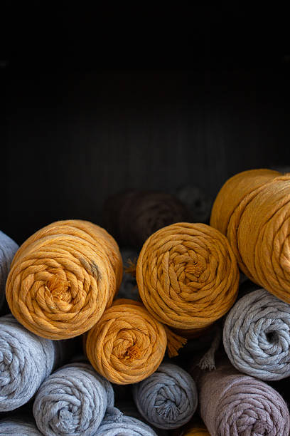 istock Multicolored cotton balls of yarn and ropes for macrame close up 2226748583
