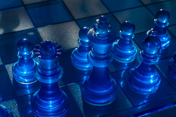 istock A mesmerizing array of glossy blue chess pieces, including a king and pawns 2226749195