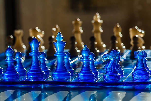 istock A vibrant chessboard scene featuring translucent blue and golden chess pieces, with a shallow depth of field 2226749499