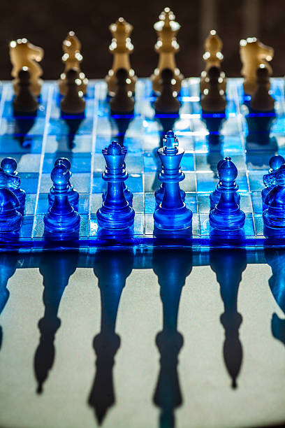 istock A captivating chessboard with translucent blue pieces and squares casts dramatic shadows 2226749528