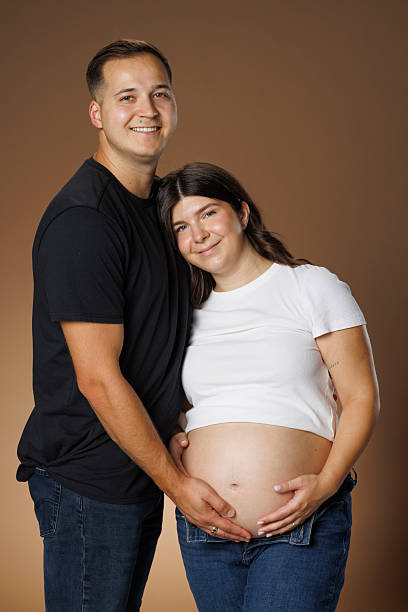 istock Young man embracing his pregnant wife.  Physical touch, irreplaceable with AI, or online. 2226750053