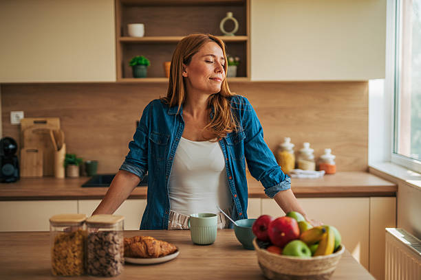 istock Serene woman enjoying a peaceful breakfast in modern kitchen 2226750297