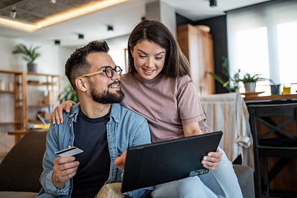 istock Couple doing online shopping using digital tablet and credit card at home 2226751573