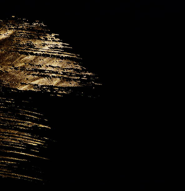 istock Abstract background brush gold painting texture on black fabric. 2226751702
