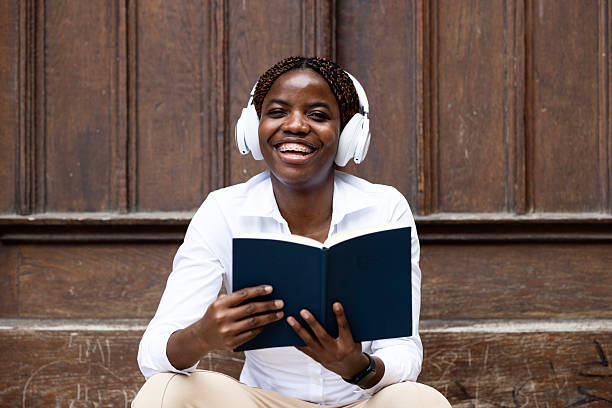 istock African American student holding book and studying. 2226753530