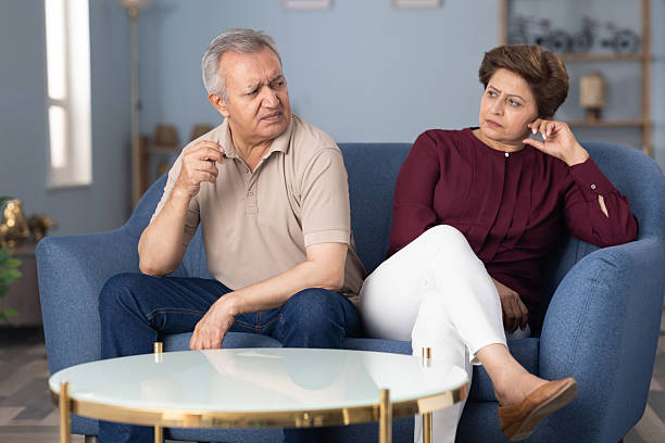 istock Senior couple sadness problems sitting on sofa at home stock photo 2226753862
