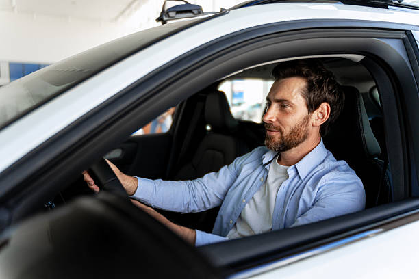 istock Customer testing a new car in the dealership showroom 2226755563