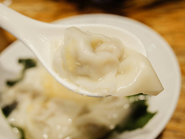istock Wonton soup bowl. Pork wonton soup with kelp sprouts 2226756818