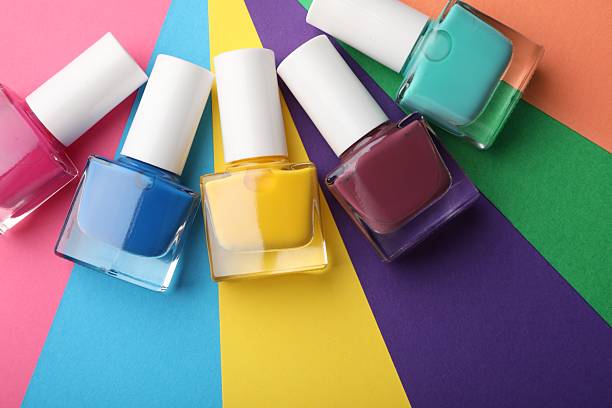 istock Set of different nail polishes on color background, flat lay 2226762563