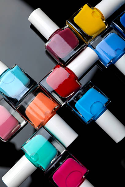 istock Set of different nail polishes in bottles on black mirror surface, flat lay 2226762716
