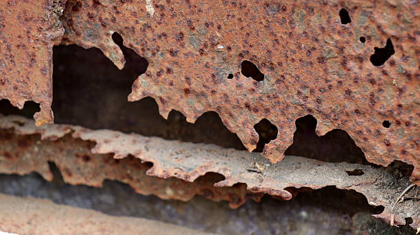istock Severely Rusted Steel Plate with Corrosion Holes and Surface Damage 2226764774