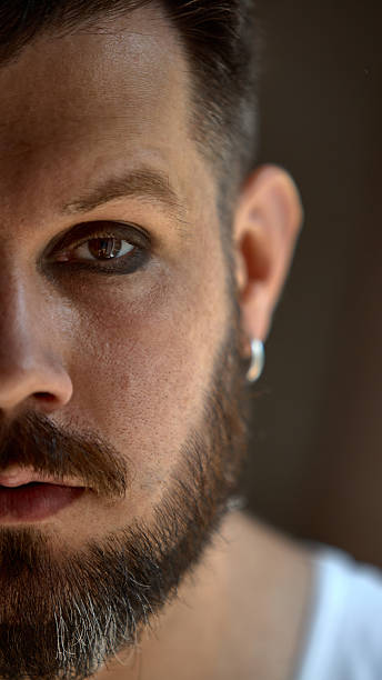 istock Bold dopamine. Close up man with gloss and dark eyeshadow. Confident and bold. 2226765026