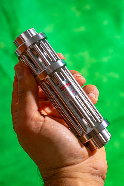 istock Chrome metal flashlight with green laser light 2226765219