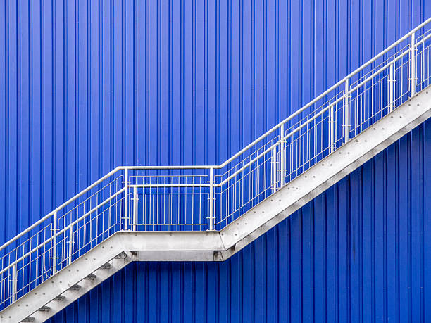 istock A galvanized steel stairs against a blue metal wall 2226767554