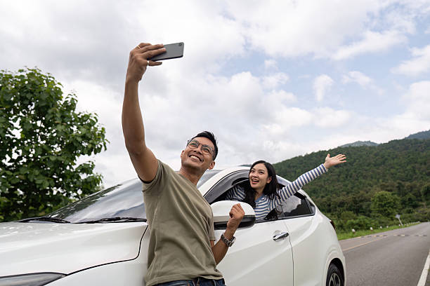istock Couple taking a selfie during their road trip 2226778524