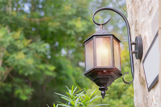 istock Vintage-style hanging outdoor lantern over nature background.  Cast iron, 2226778765