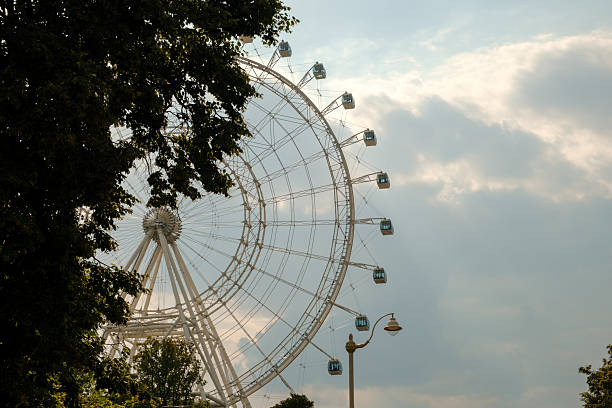 istock VDNKH Park. A breathtaking scenic view featuring a giant Ferris wheel set against a dramatic, cloudy sky 2226780178