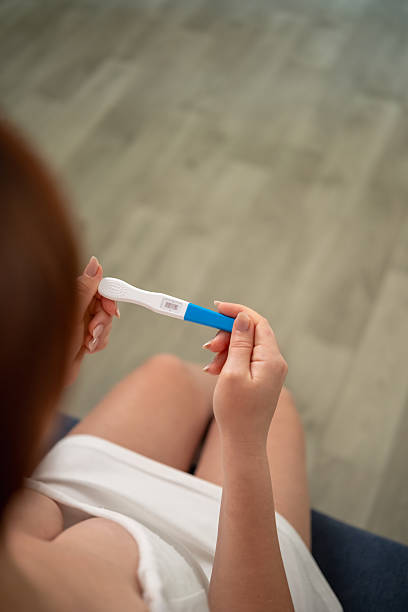 istock A woman holds a pregnancy test with two stripes in her hands 2226780553