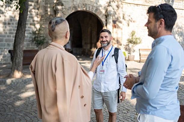 istock Tour guide leading visitors through historic fort courtyard on a sunny day 2226784608