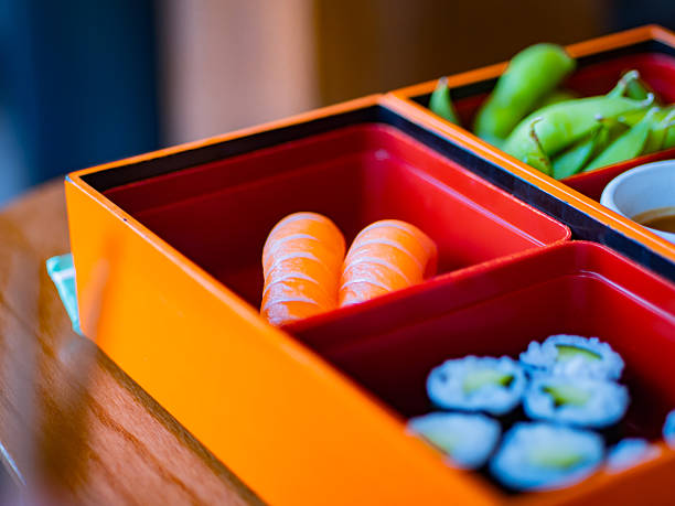 Colorful bento box with sushi, edamame, and dipping sauce served in a Copenhagen restaurant