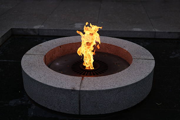 istock A flame flickers in a circular stone structure, creating a captivating nighttime atmosphere 2226785064