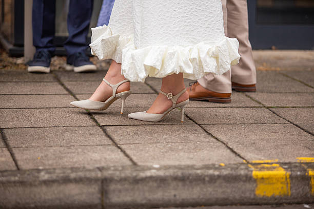 istock Legs of bride and bridegroom 2226789302