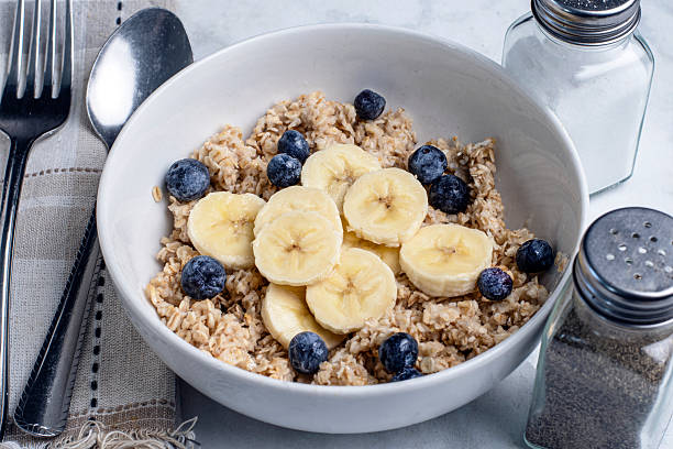 istock oatmeal top with bannanas and blue berries 2226789425