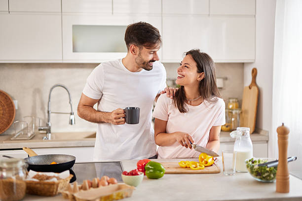 istock Young couple preparing breakfast together in modern kitchen 2226789830