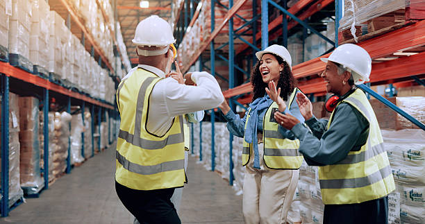istock Man, group and dancing for logistics at warehouse, smile and success with motivation, team and support. People, mentor and women with applause, celebration and goal for supply chain at storage plant 2226792349