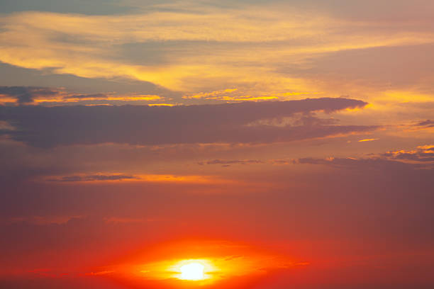 istock Vibrant dusk with the sun sinking below horizon 2226795139