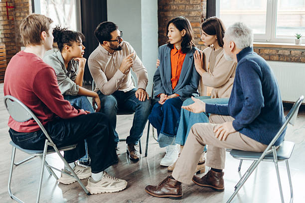 istock Diverse group of people supporting each other during therapy session 2226795495
