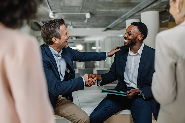 istock Two men celebrating success with a handshake 2226795523