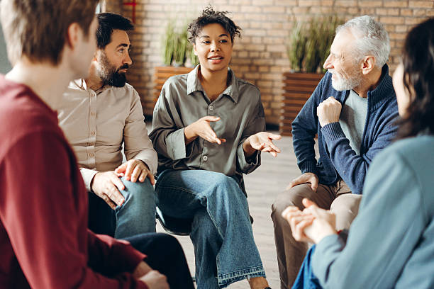 istock Patients listening to doctor during group therapy session 2226795526